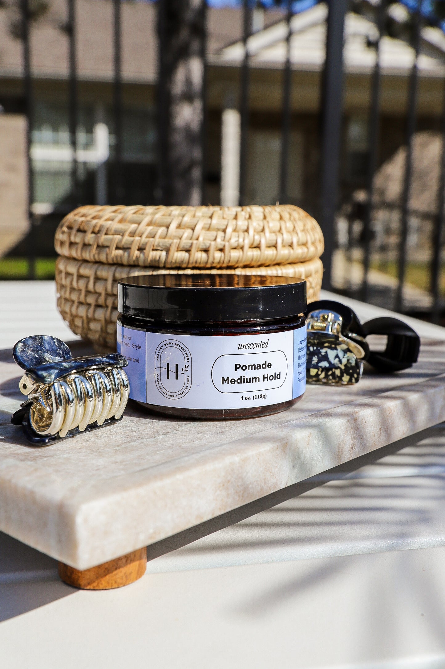 Medium-hold hair pomade in a jar, providing flexible styling, natural shine, and long-lasting control for all hair types.