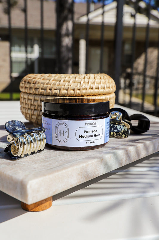 Medium-hold hair pomade in a jar, providing flexible styling, natural shine, and long-lasting control for all hair types.