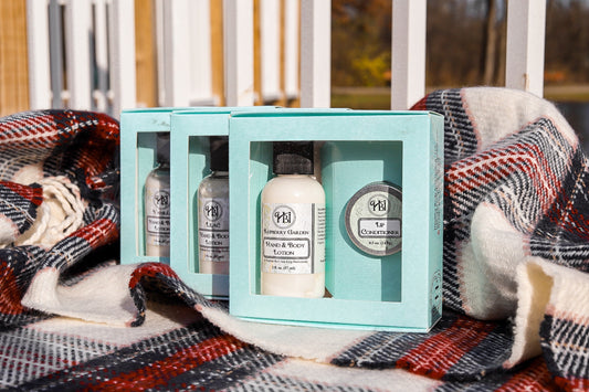 Gift box bundle of 3 lotion and lip conditioner products for soft, hydrated skin and lips, perfect for self-care or gifting.